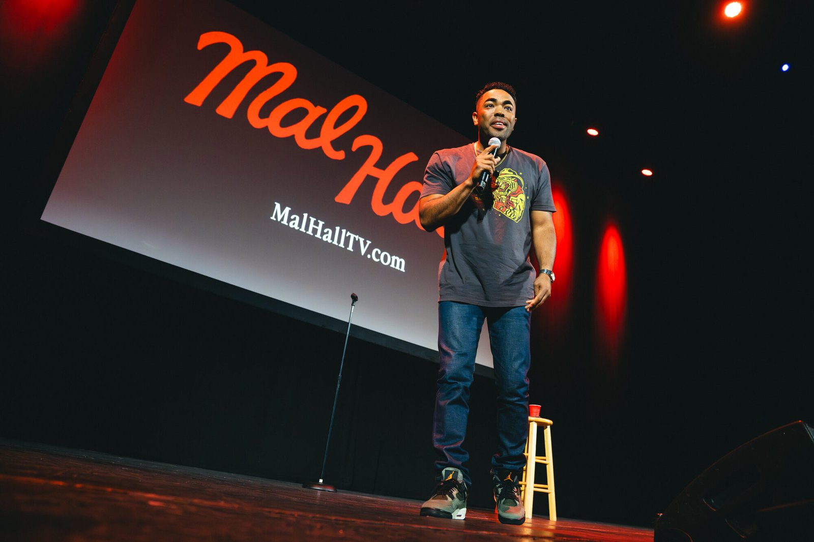 Mal Hall on stage in front of his MalHall screen